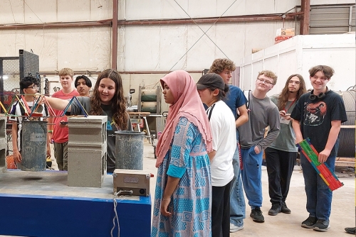 NSTI Students Load-Testing Popsicle Bridges