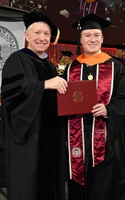Braden Labenz on graduation day with Dean Klier. 