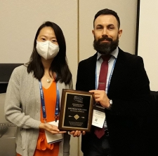 Dr. Galizia with student receiving award