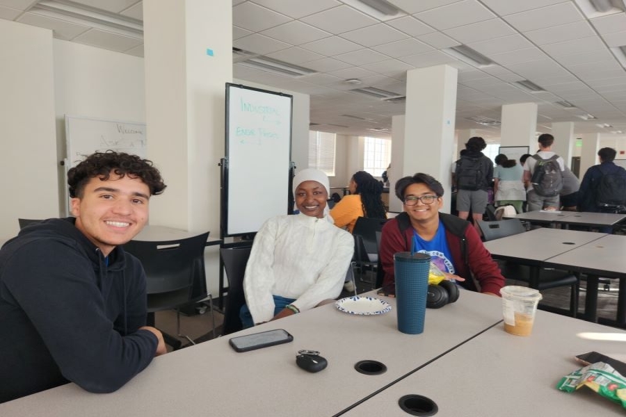 Several students sitting in class, smiling
