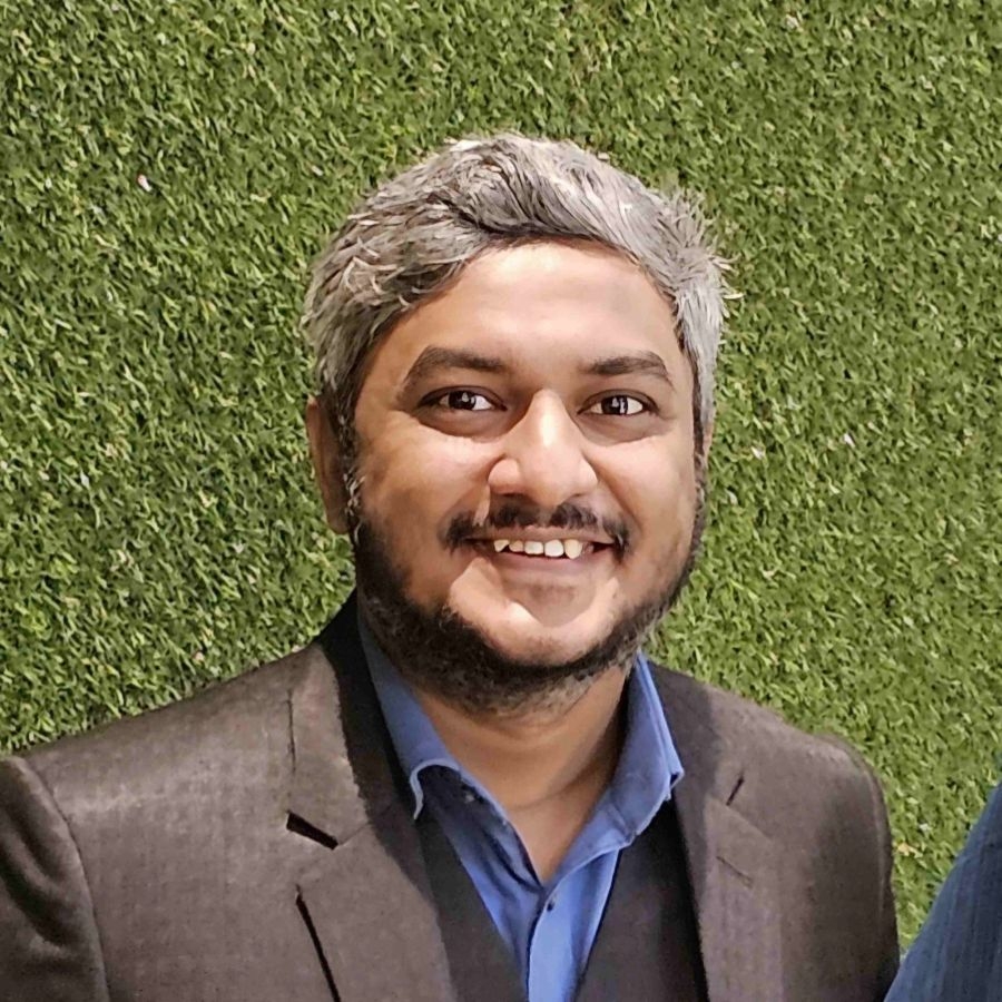 A man in a grey suit.