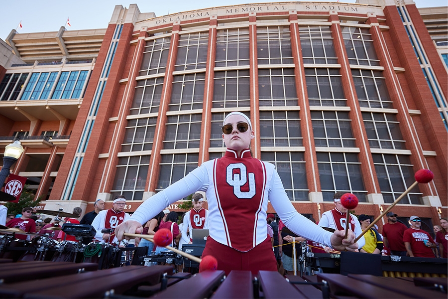 O U Pride of Oklahoma member playing instrument. 