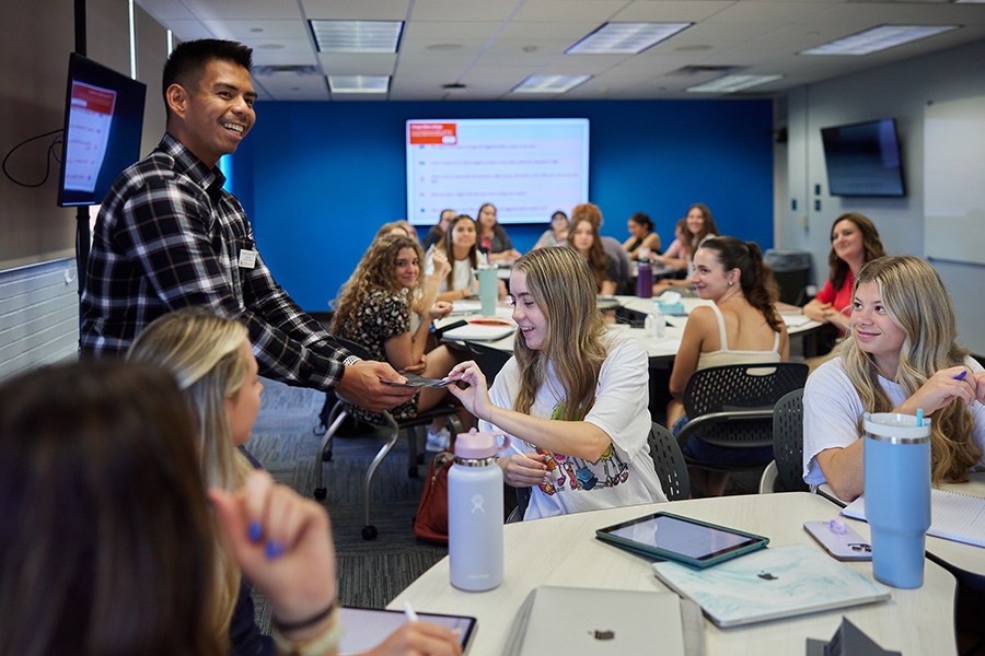 Professor distributing course materials.