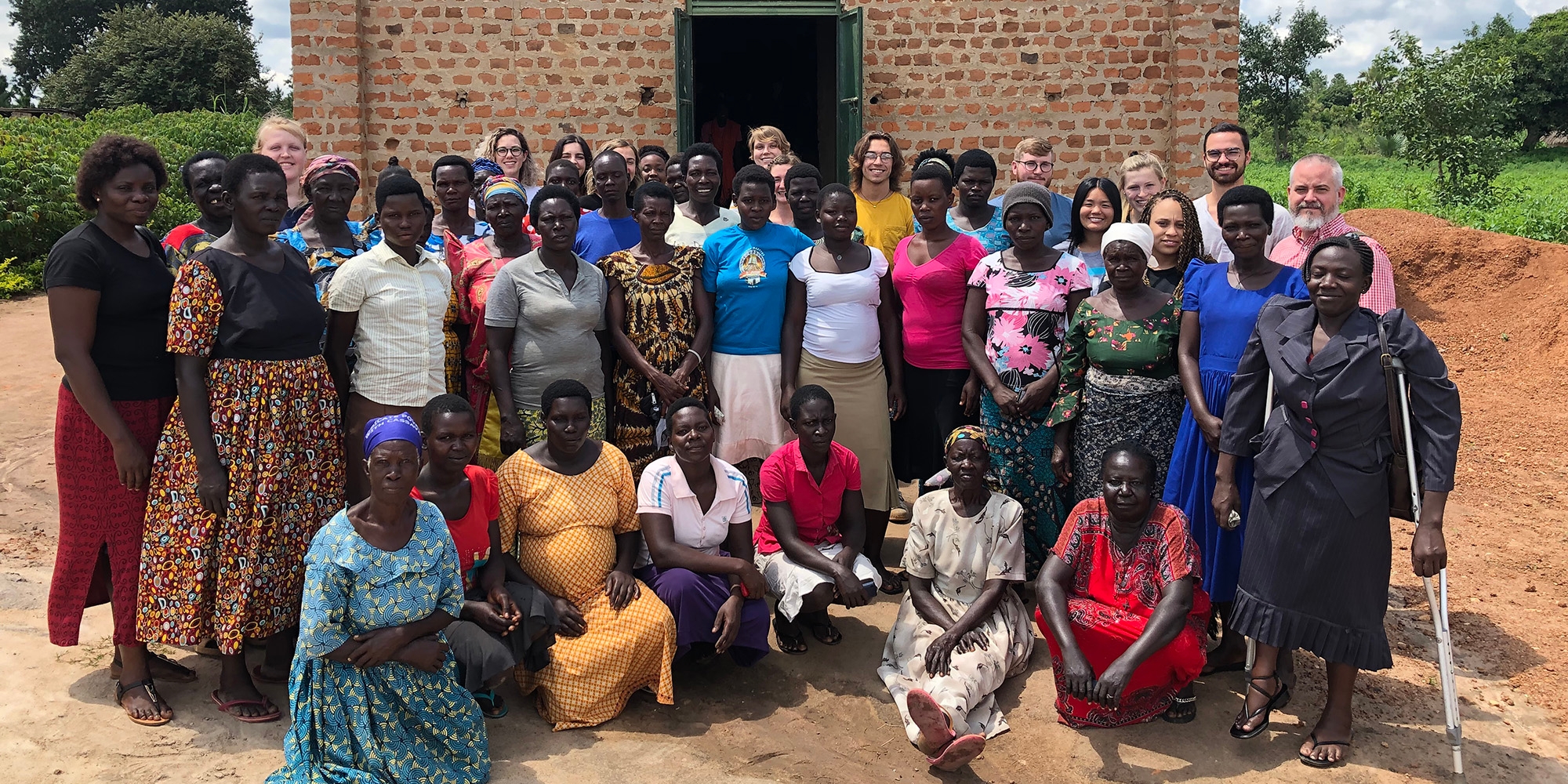 Lango Women's Peace and Development Champions, People standing in front of center.