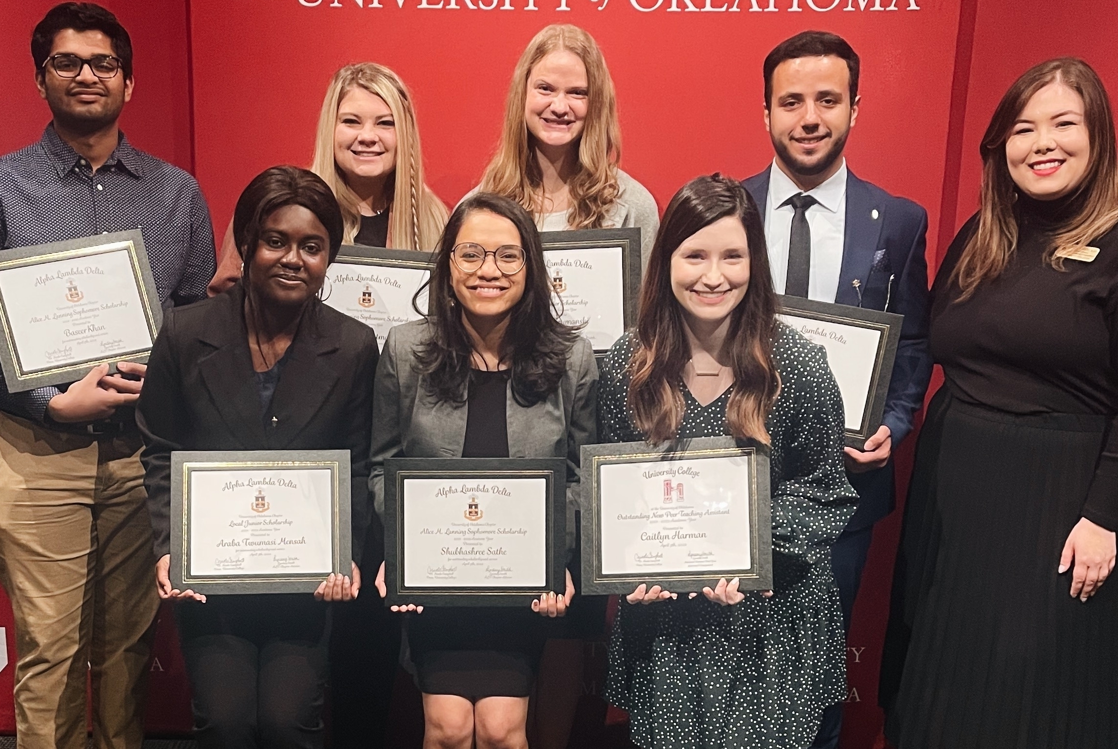 A group of students holding up ALD awards.