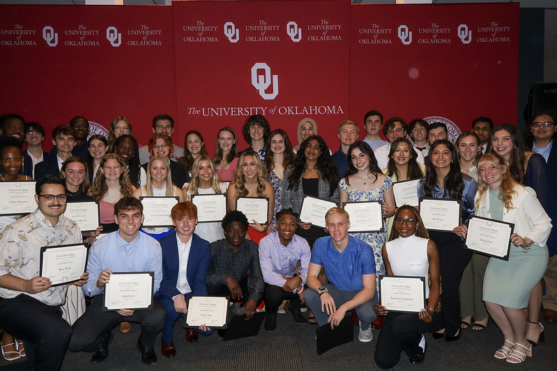 A group of students posing with awards.