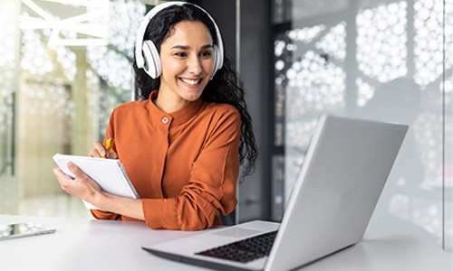 Business student taking remote test on her laptop