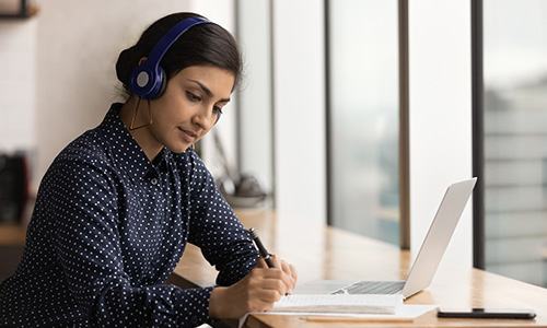 Foreign language student listening to language recordings