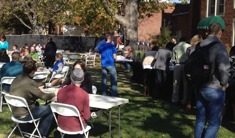 A cookout event on the lawn outside of Wagner Hall.