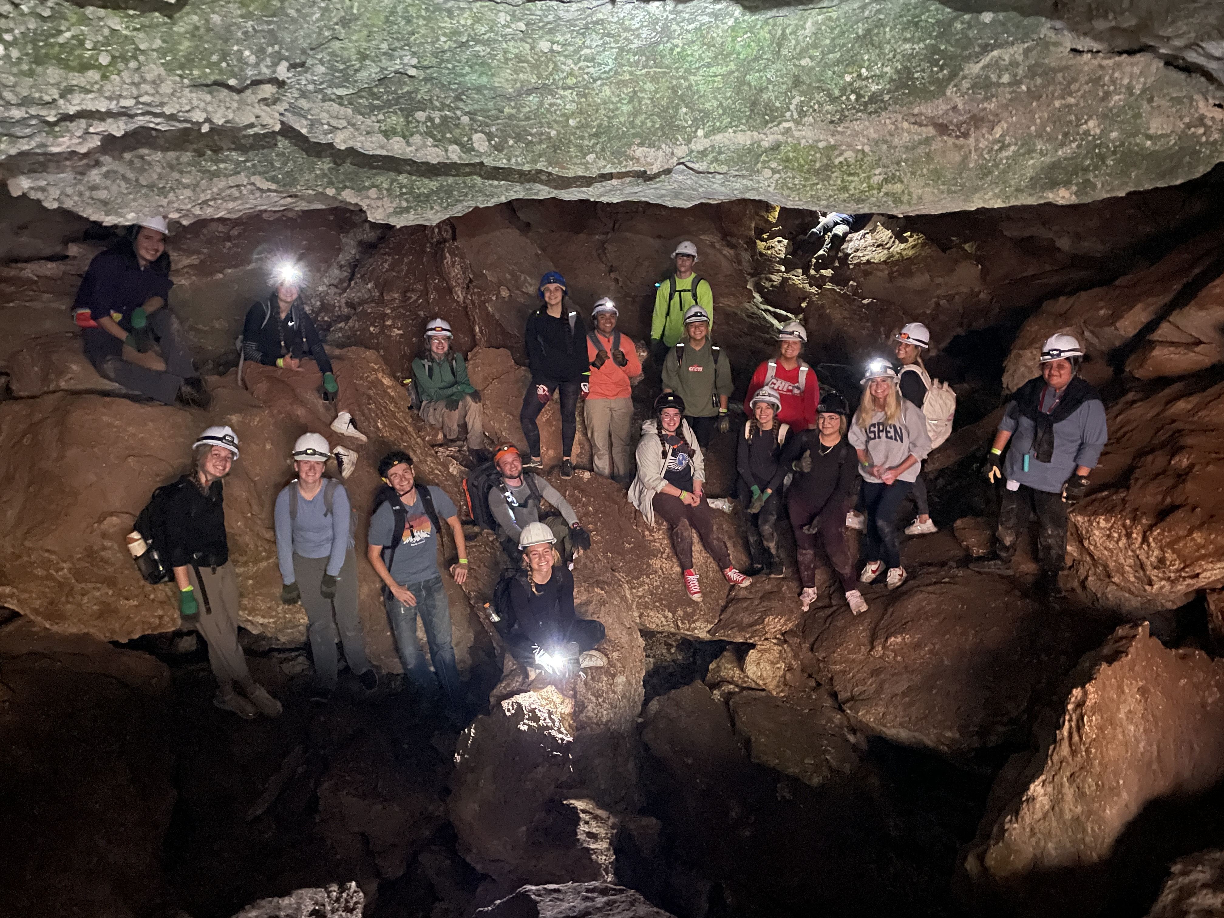 Students underground in a cave.