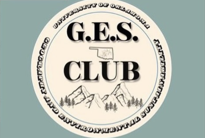 G.E.S. Club with a circle logo in front of mountains.