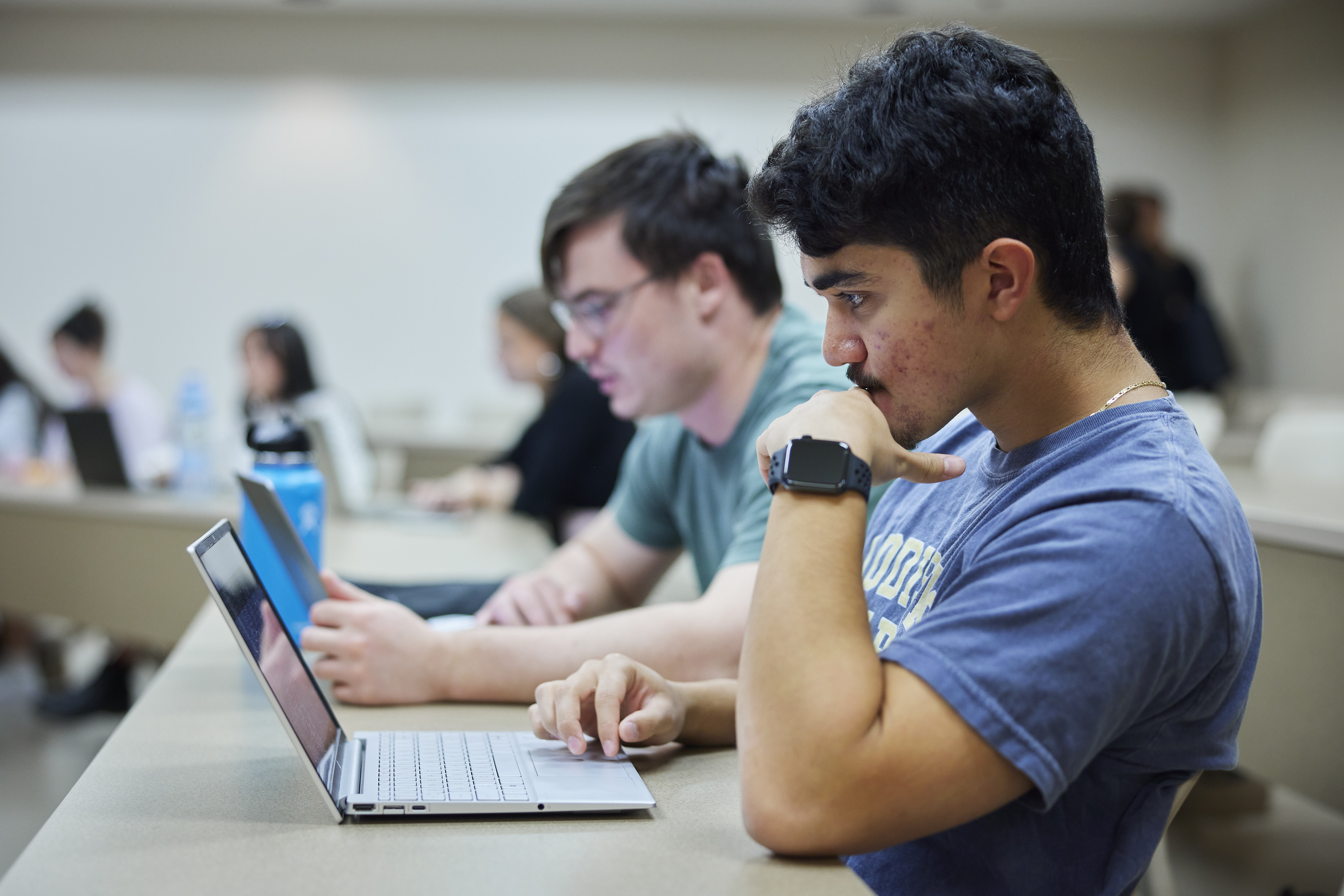 Students sitting in a classroom.