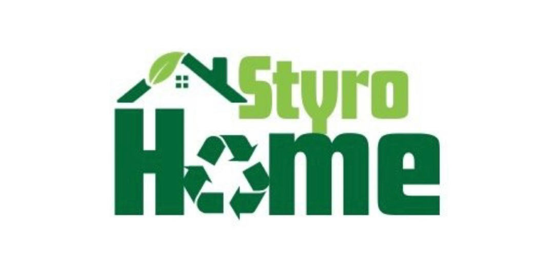 Student pinning notes on a bulletin board.