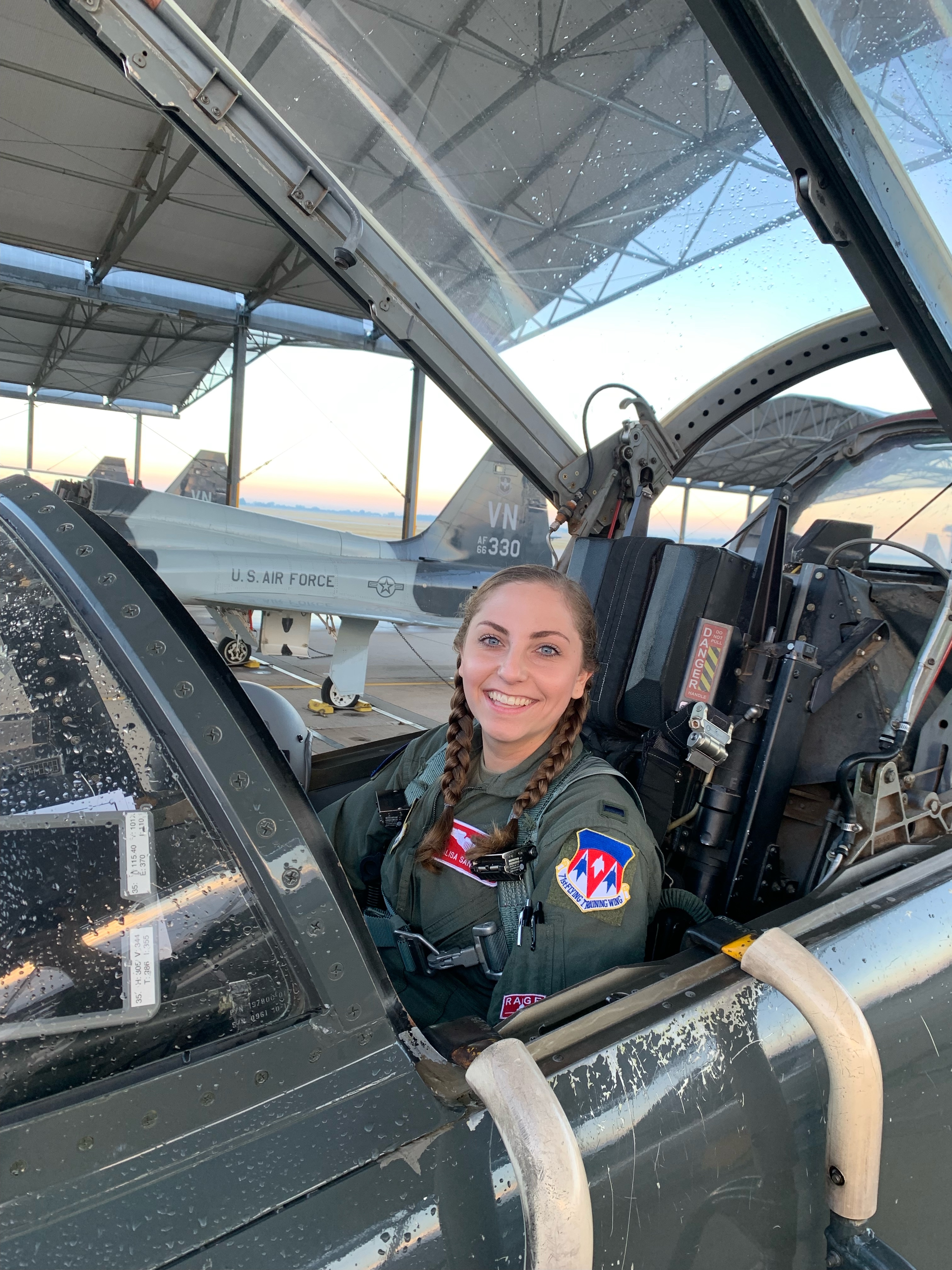 Annalisa Sanfilippo sits in the cockpit of a plane.