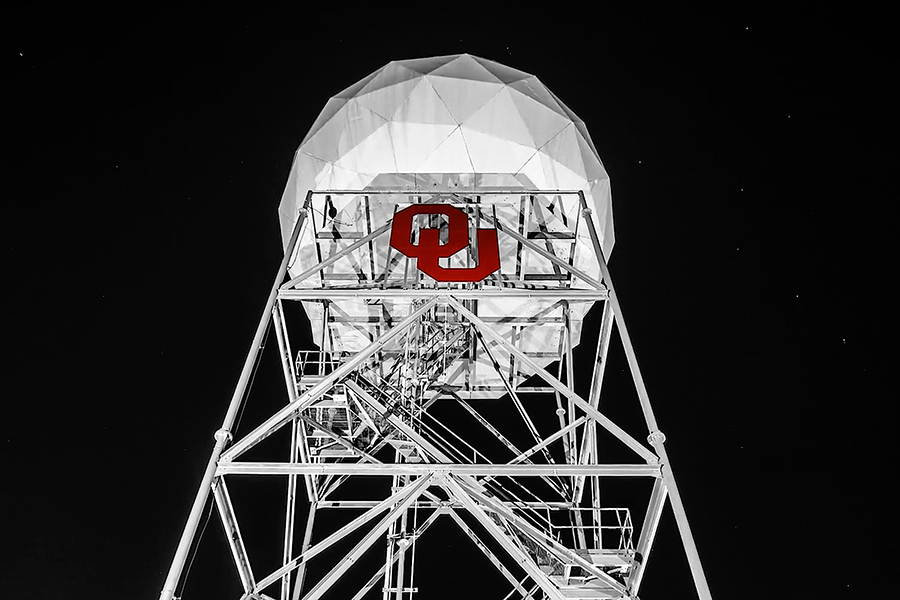 A radar tower with an interlocking OU sign in crimson on the front.