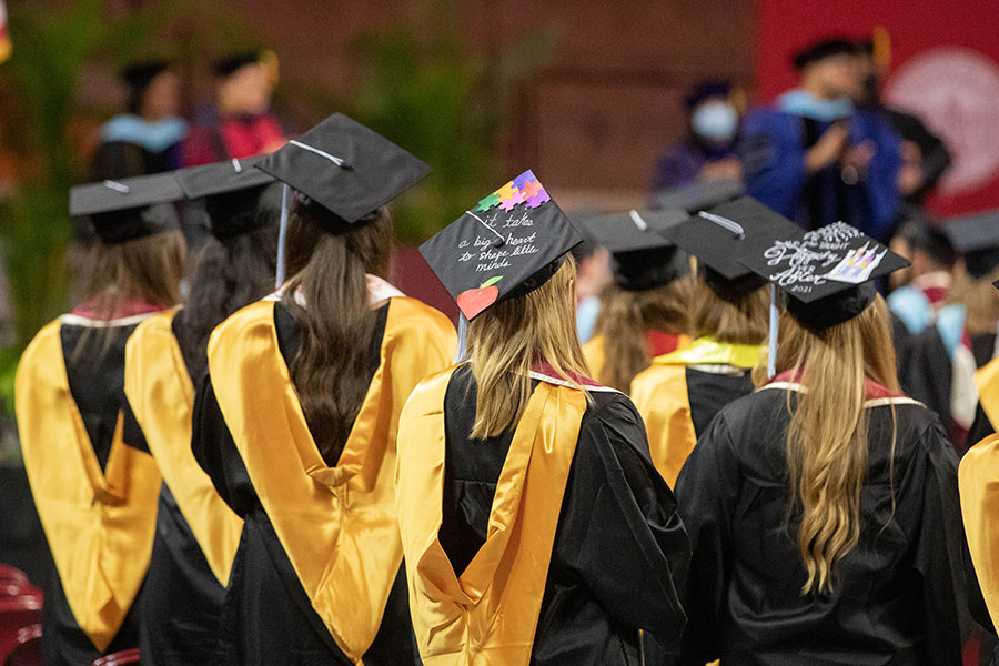 Students in graduation regalia.