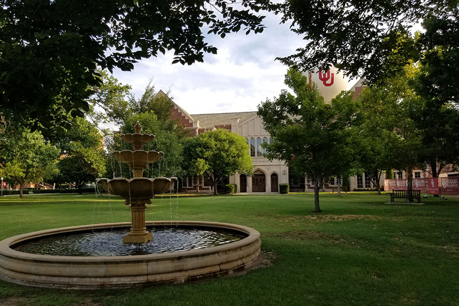 A water fountain surrounded by trees on the O U campus in Norman.
