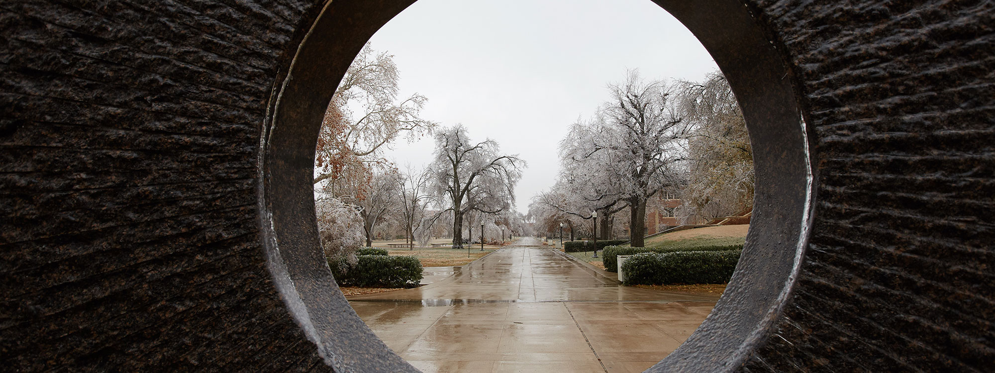 View through sculpture near Bizzell Library on OU Norman campus