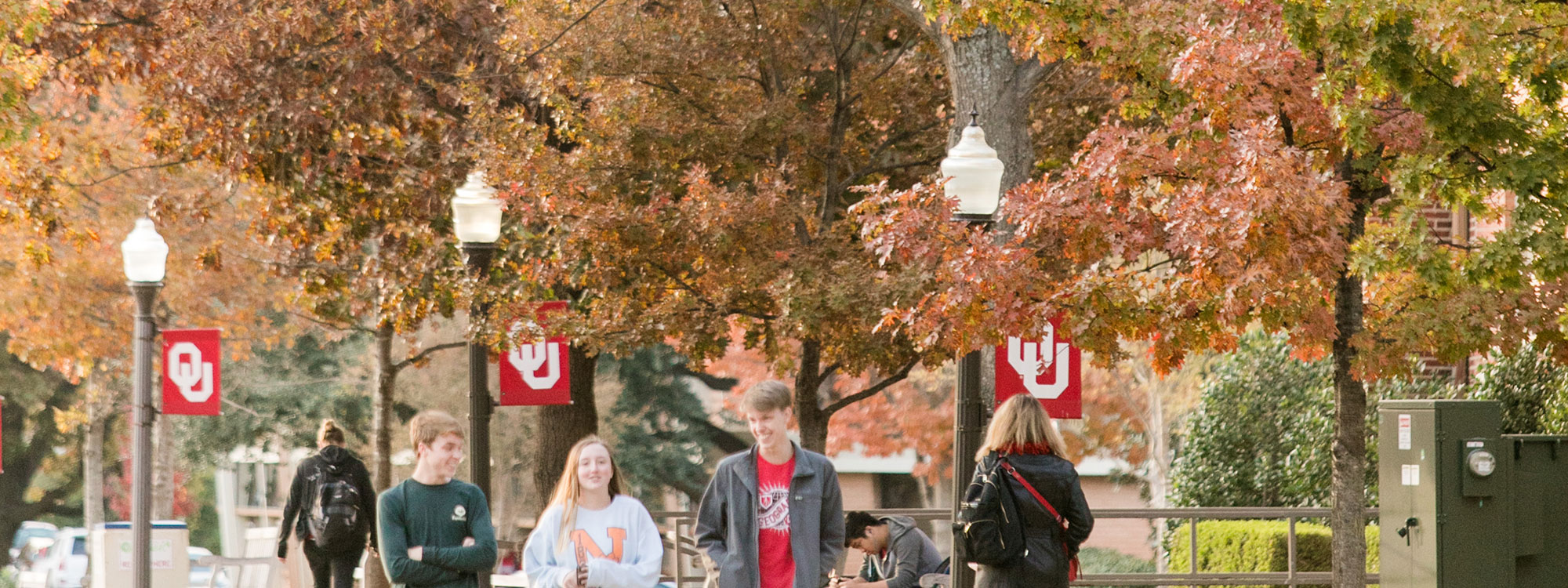 View of Norman campus in the fall with students walking