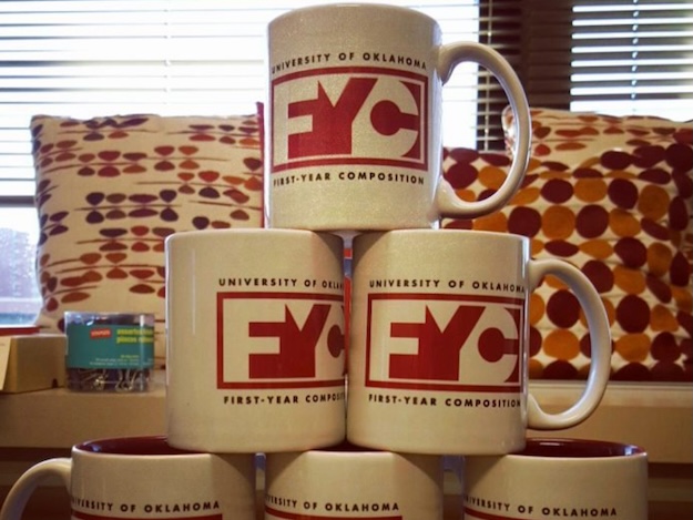 A stack of FYC mugs set up in a pyramid.