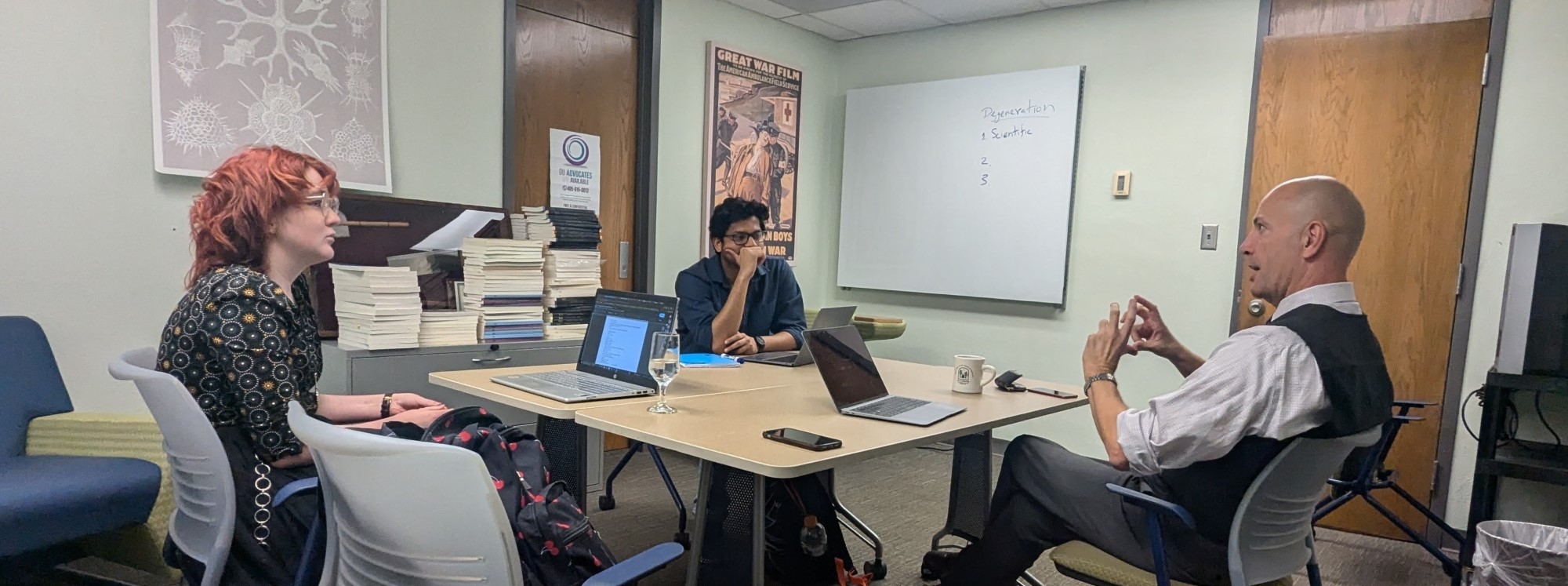 Dr. Hale speaking with graduate students Emily Laiben and Goutham Sukumaran