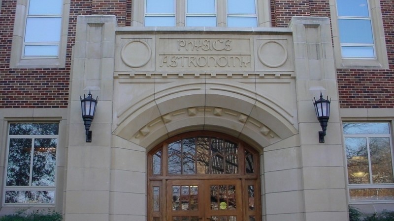A photo of the Nielsen Hall Physics & Astronomy arch entrance.