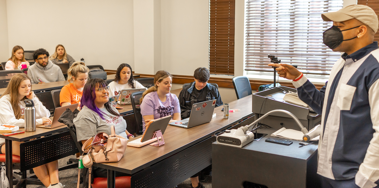 James Howard Hill, Jr., Ph.D. teaching his students in class.