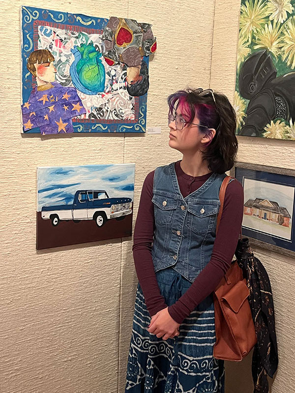 Dr. Harris’ daughter, Sophie Harris, and her artwork at the MGMOA High School Juried Art Exhibition.