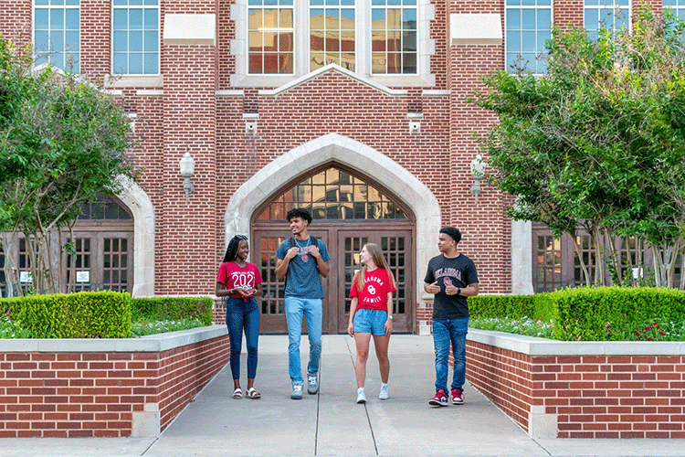 Four students walking together