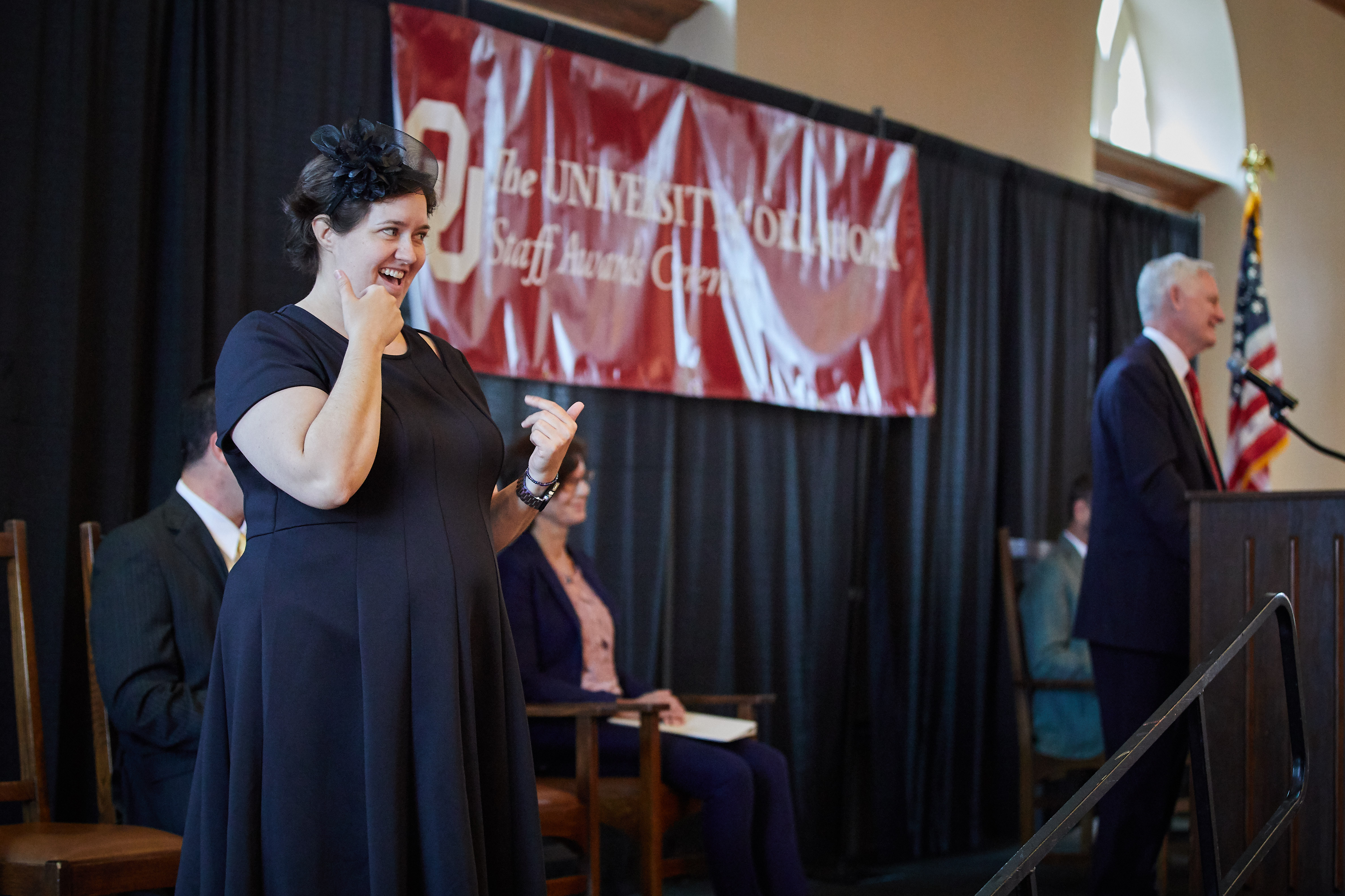 ASL interpreter, Amber Smith, interpreting at the 2019 staff awards