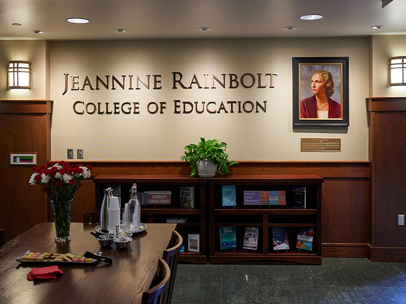 portraint of jeannine rainbolt hanging on the wall in the Collings Hall lobby.