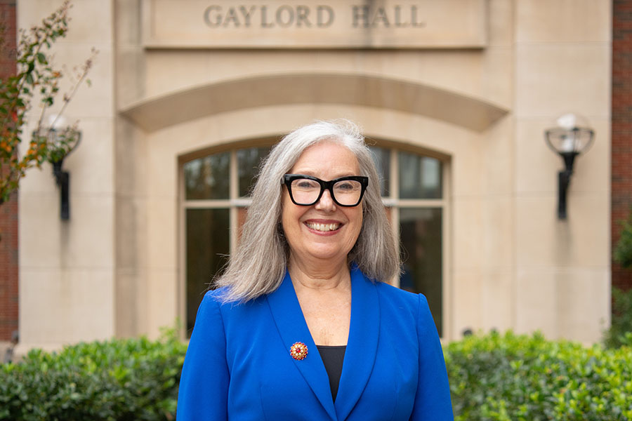 Dr. Desiree Hill standing in front of Gaylord Hall.