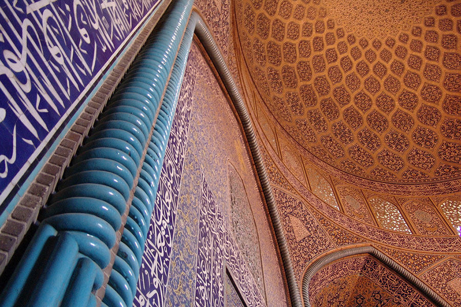 Middle Eastern architecture featuring a decorated ceiling and wall.
