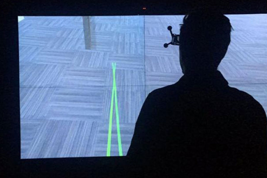 A person working with technology in the B I M Visualization Lab.