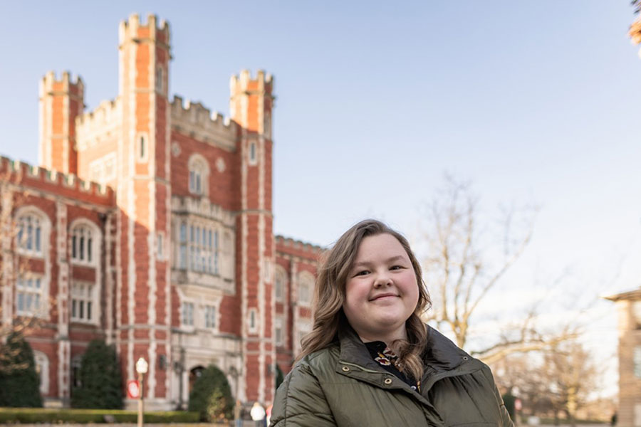 Kim Huff in front of a building.
