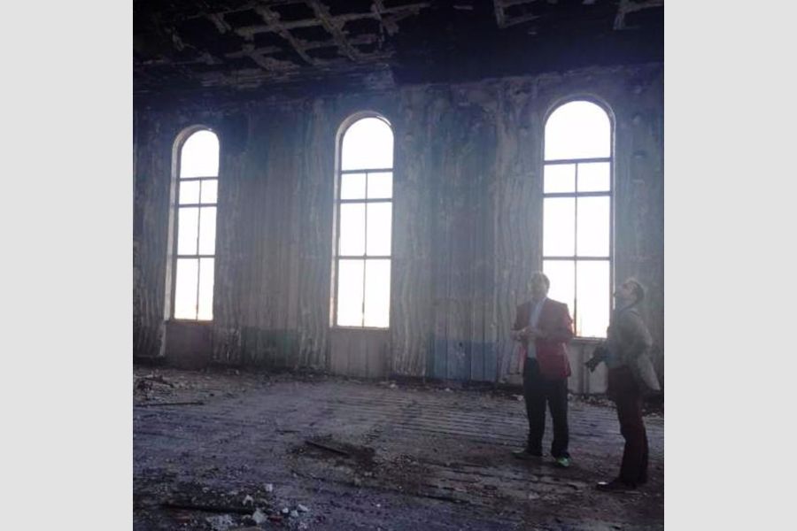 The team explores the Tulsa Club, an active restoration project.