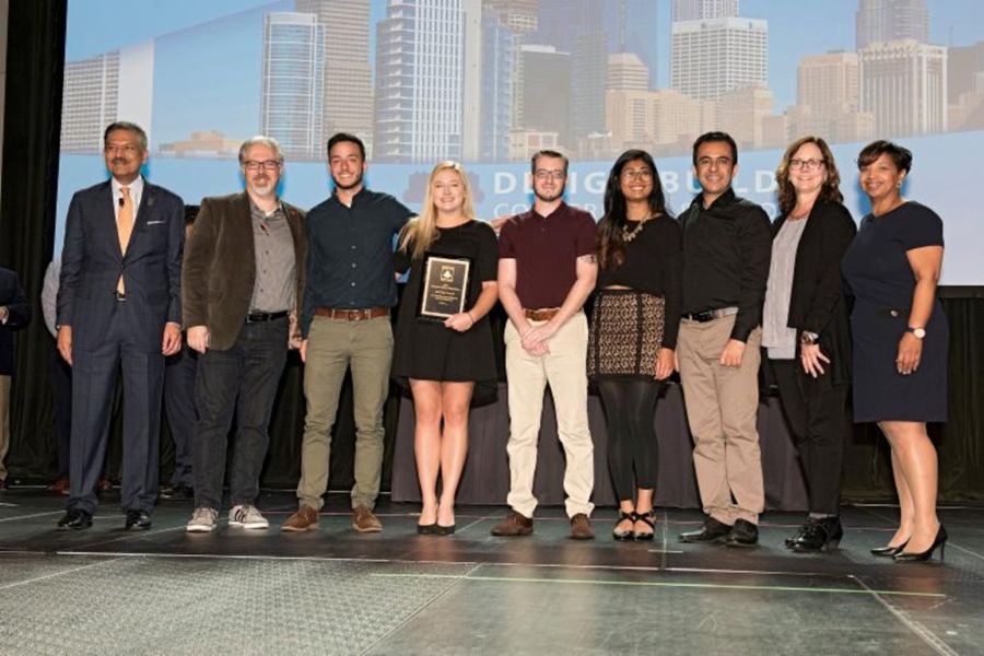 The O U team accepting their award.