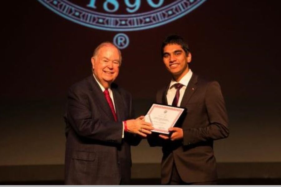 O U president Boren in picture handing gift to Pranav Mohan.