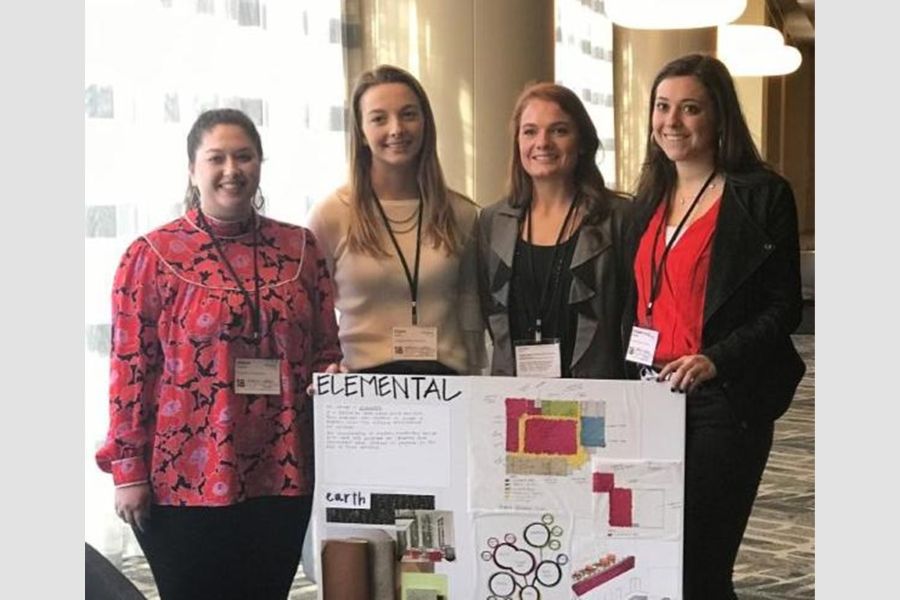 Jillane Tatarian and her teammates with a board showing their design entitled Elemental.
