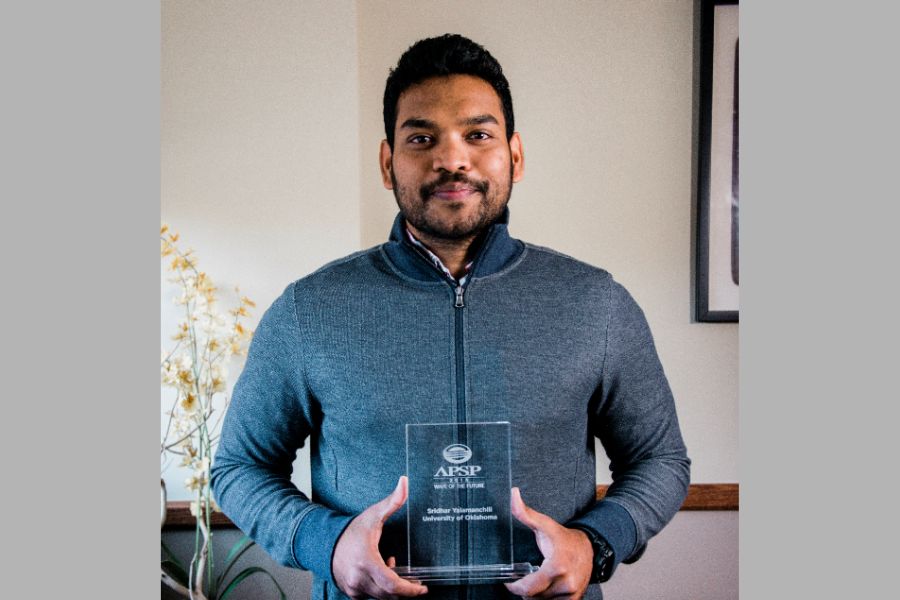 Picture of Sridhar Yalamanchili holding Association of Pool & Spa Professionals award.