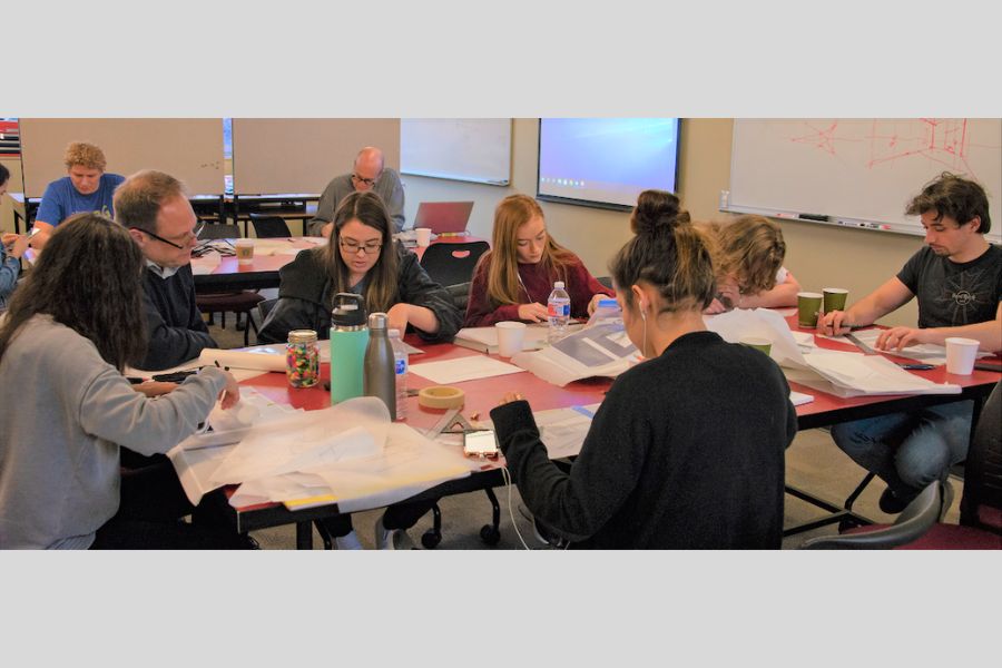 Photo of Dagg’s workshop working with architecture students on designs.