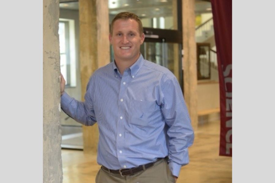 Photo of Ben Bigelow standing in a foyer