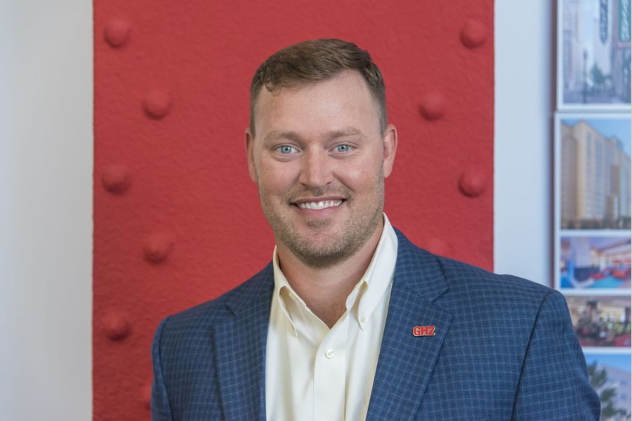 Headshot of Jeremy Carlisle against a red background