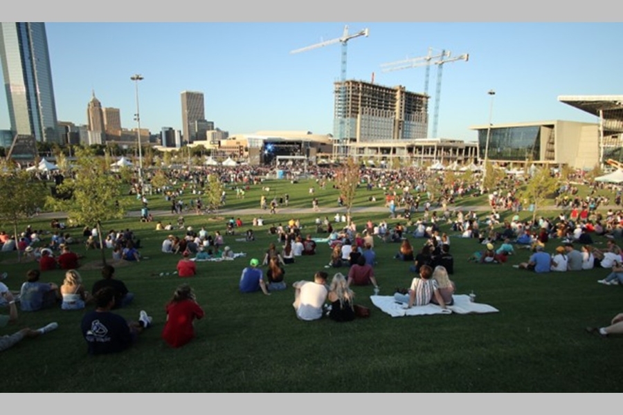 The lawn of Scissortail Park, looking toward the performance stage and downtown.