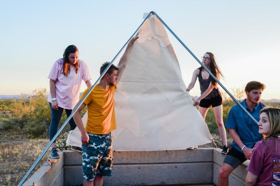 Students assembling a screen intervention for a shelter in the desert.