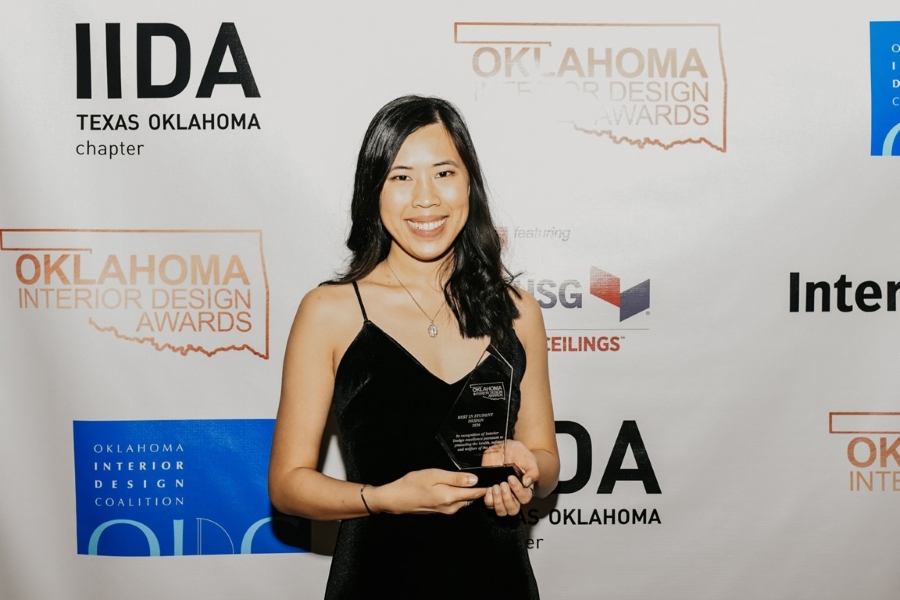 Keyvie Troy at the Interior Design Awards Competition holding Best in Show award.