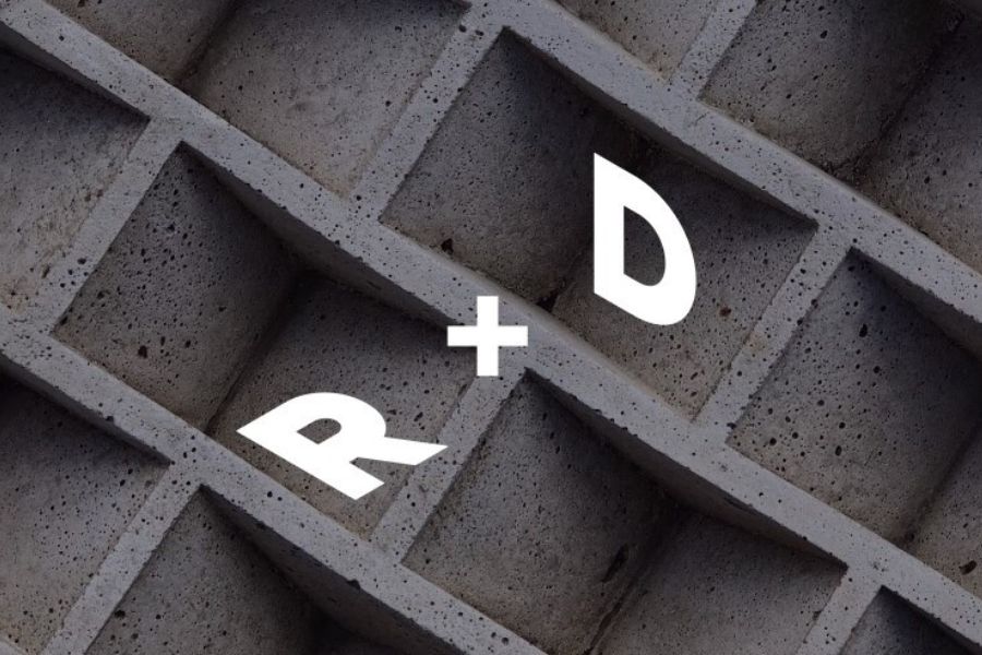 Background of aerated concrete in a geometric pattern with "R plus sign D" graphically on top.