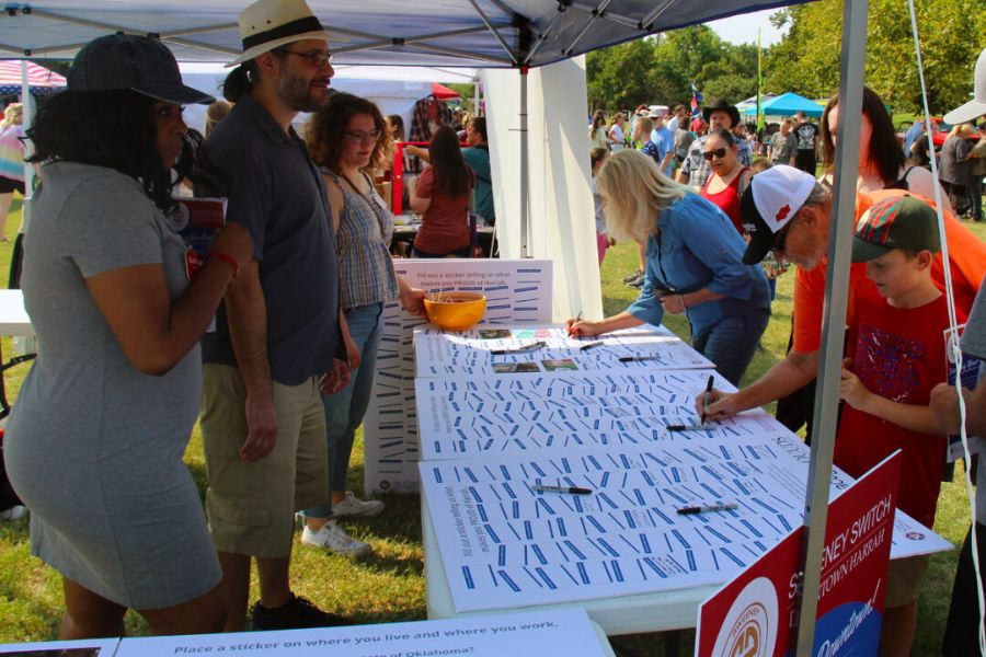Community members share feedback at an urban design booth during the Harrah Days event.Community members share feedback at an urban design booth during the Harrah Days event.