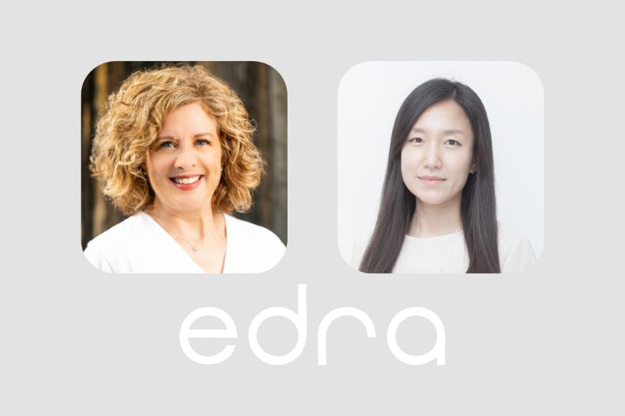 Dawn Loraas and Yeji Yi with the logo for the Environmental Design Research Association.