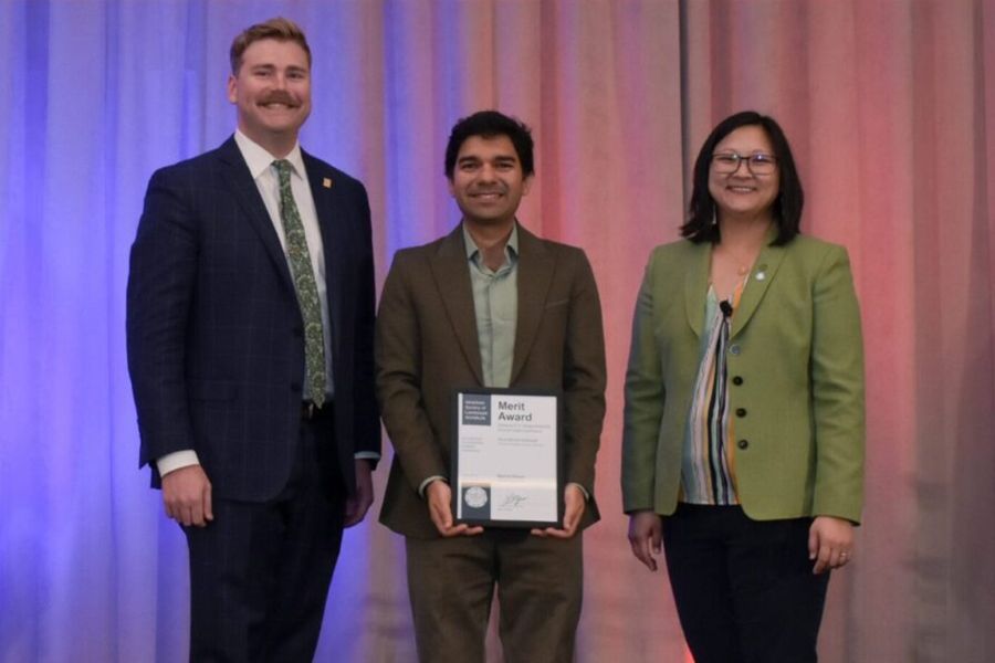 Iman Moradi Naftchali receiving the merit award.